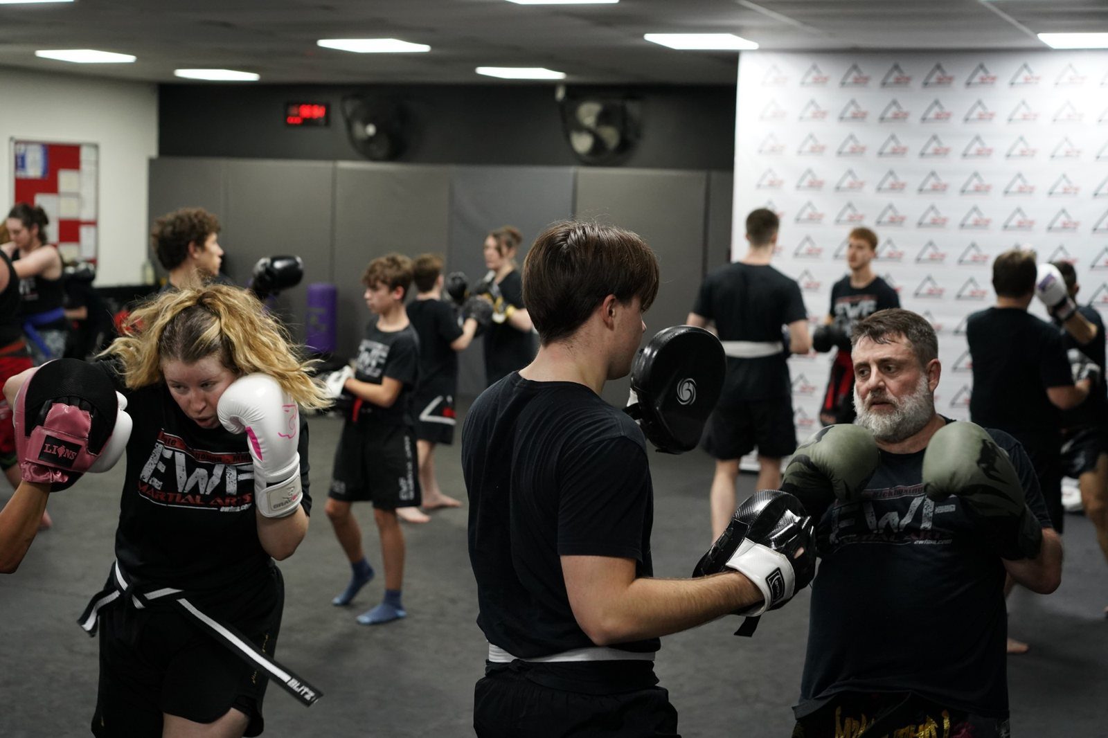Kickboxing pad work for teens and adults at EWF Martial Arts